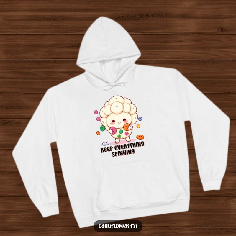 Funny Kawaii cauliflower character juggling colorful buttons while wearing a cozy and humorous hoodie.