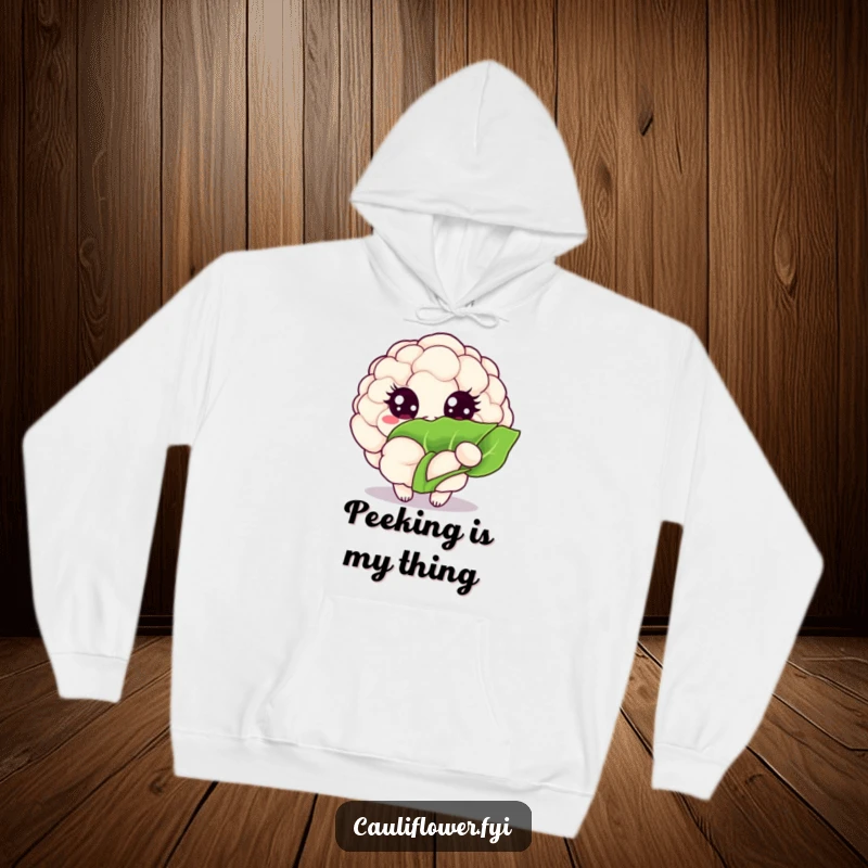 Funny Kawaii cauliflower hoodie shows a veggie with big, sparkling eyes peeking from behind a leaf, adding a cute surprise.