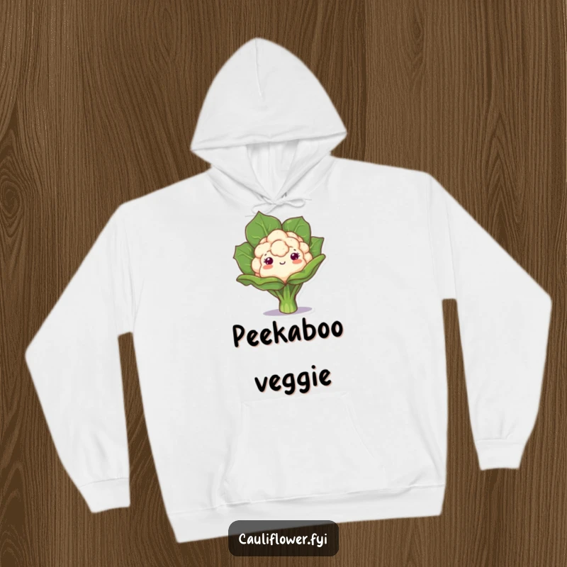Funny hoodie with a kawaii cauliflower playfully peeking from behind a leaf, offering cozy comfort and charming, whimsical humor.